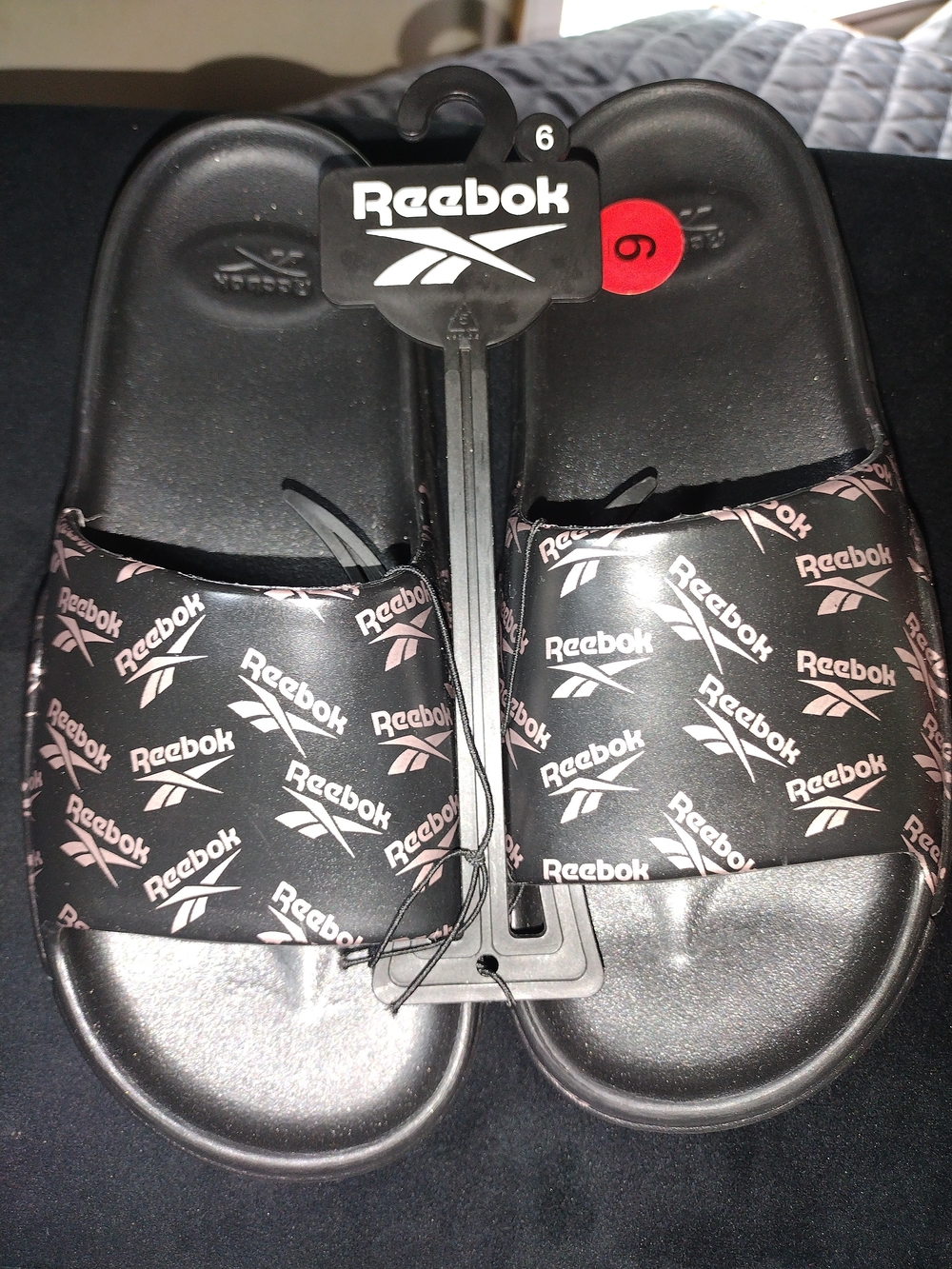 Brand New Reebok Black Slides with Pink Logo Pattern